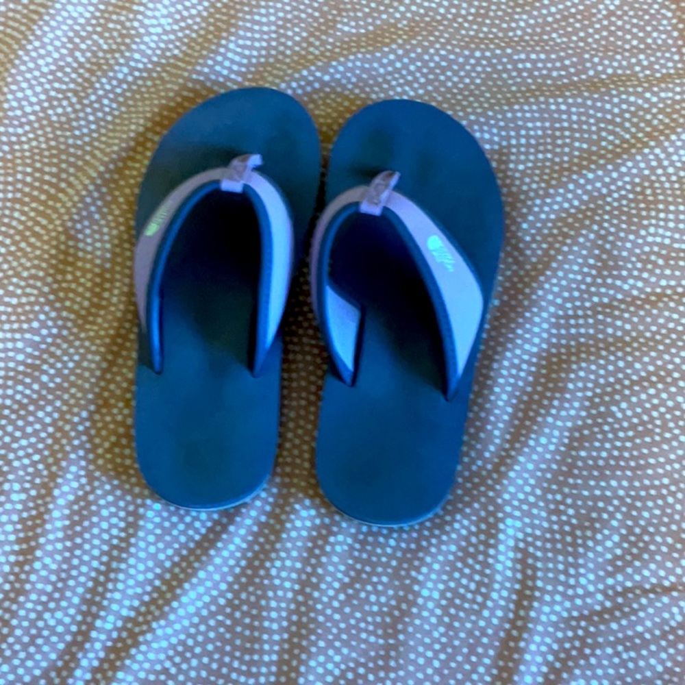 Purple north face brand flip-flops